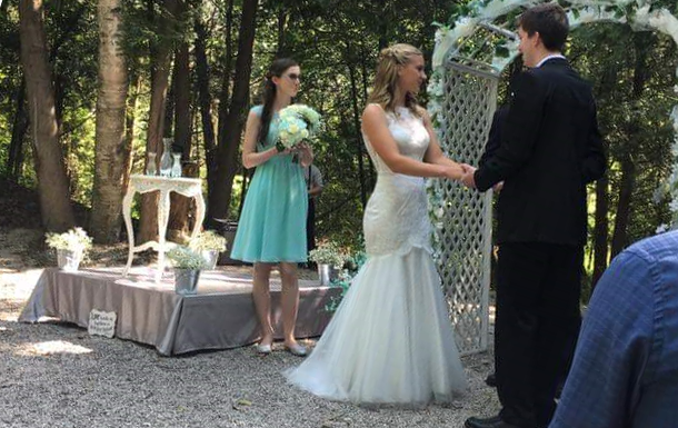 wedding ceremony held in the firebowl area at camp