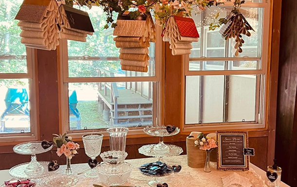 hanging decoration and the decorate dessert table in the dining hall for a wedding