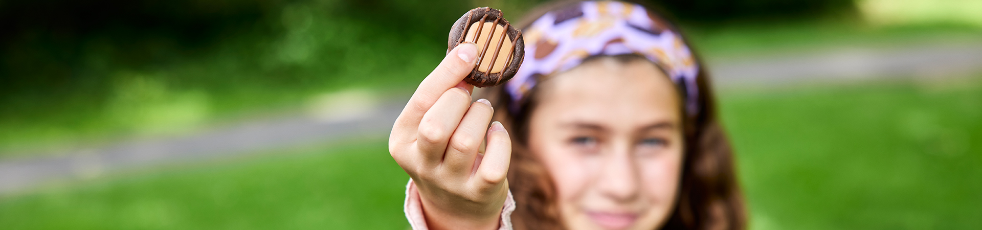  girl scout holds a girl scout cookie 