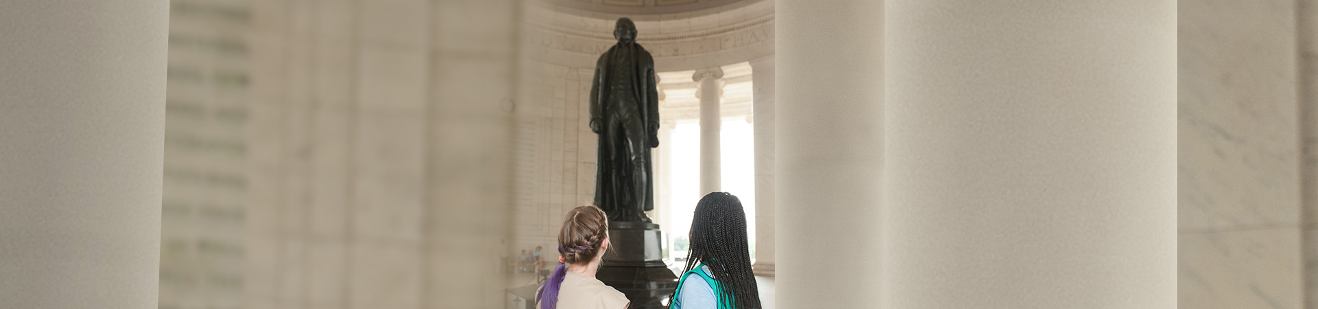  two girl scouts admiring a statue in washington dc 