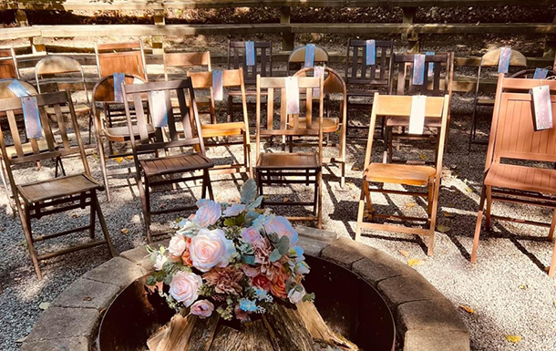 ceremony decorations and set up in the firebowl area at camp for a wedding ceremony