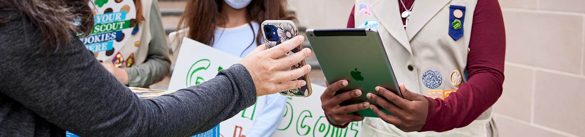  group of girl scouts sell cookies using technology 