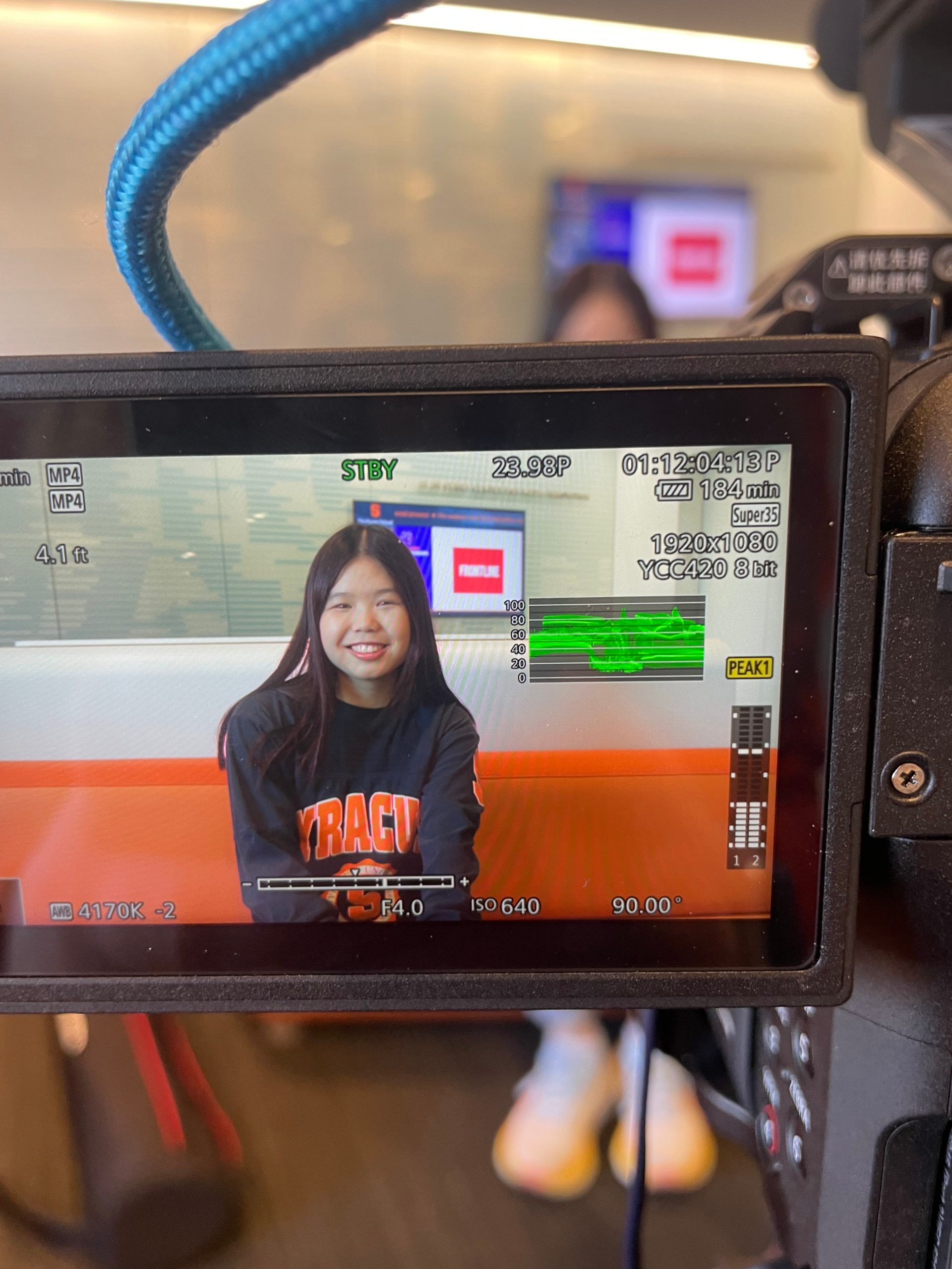 Author of article sitting in front of a camera